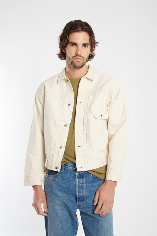 ecru button up denim jacket with one chest pocket.